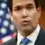 US-Außenminister Marco Rubio steht vor einer US-Flagge, er runzelt leicht die Stirn und schürzt die Lippen