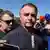 Brazil's former President Jair Bolsonaro speaks to the press Brasilia, Brazil, Friday, July 18, 2025.