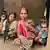 Raje Oyam (center), who was hit by bullet on her back during military operation in Bodga village