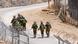 Israeli troops patrol the border fence with Syria near the Druze village of Majdal Shams in the Israel-annexed Golan Heights Israeli troops patrol the border fence with Syria near the Druze village of Majdal Shams in the Israel-annexed Golan Heights