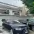 The man hung up flags outside the property, parked luxury cars with fake license plates