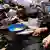 Palestinians gather to receive food from a charity kitchen