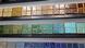 A row of Pewabic Pottery tiles in various colors on display in Detroit, Michigan A row of Pewabic Pottery tiles in various colors on display in Detroit, Michigan