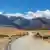 A road winding through a rural landscape in Cordillera de Los Andes, Peru, South America