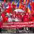 A large crowd of people holding Moldovan flags and political posters