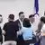 Taiwan's main opposition Kuomintang (KMT) chairman Eric Chu (3rd-L) hugs lawmakers after a recall election in Taipei