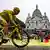 Tadej Pogacar cycles past the Sacré Coeur en route to winning the Tour de France