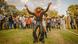 A young man dressed as a cowboy leads line dancing at International Cowboy Day. A young man dressed as a cowboy leads line dancing at International Cowboy Day.