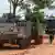 Armoured personnel carriers (APC) are seen on a road near Thailand-Cambodia's border in Sisaket province, the day after the leaders of Cambodia and Thailand agreed to a ceasefire.