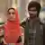 A scene from "Haider" (2014) showing a woman and a man in a street
