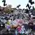 A mass of flowers, cards and other items related to Ozzy Osbourne at Black Sabbath Bridge in Birmingham 