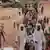 Sudanese people, who fled the conflict in Murnei in Sudan's Darfur region, cross the border between Sudan and Chad in Adre, Chad August 4, 2023.