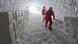 Two scientist in an ice cave storing ice samples Two scientist in an ice cave storing ice samples