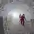Two scientist in an ice cave storing ice samples