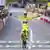 Pauline Ferrand-Prevot crosses the line, arms outstretched in the yellow jersey, on the final stage