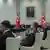Cumhurbaşkanlığı Külliyesinde yapılan YAŞ toplantısı sırasında katılımcılar bir masa etrafında oturuyorlar