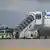 Police boarding the aircraft that took the family back to Iraq on July 22, 2025