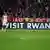 Bayern Munich play a match in front of advertising hoarding that read 'Visit Rwanda'