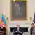 US President Donald Trump sits at a long table between Azerbaijan's President Ilham Aliyev and Armenia's Prime Minister Nikol Pashinyan in the State Dining Room of the White House, Friday, Aug. 8, 2025, in Washington.
