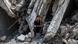 A boy sits among rubbles after an Israeli airstrike in the Al-Rimal area, west of Gaza City, on August 8, 2025 A boy sits among rubbles after an Israeli airstrike in the Al-Rimal area, west of Gaza City, on August 8, 2025