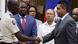 Viongozi wa Haiti Vladimir Paraison Laurent Saint-Cyr wakipeana mikono Viongozi wa Haiti Vladimir Paraison Laurent Saint-Cyr wakipeana mikono