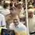 Congress party leader Rahul Gandhi enters the police station surrounded by officers