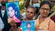 Tamil women hold up pictures of their loved ones at a protest in Jaffna, Sri Lanka Tamil women hold up pictures of their loved ones at a protest in Jaffna, Sri Lanka