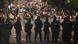 A line of Serbian riot police block a road during during an anti-government protest near Serbian Progressive Party office in Belgrade, Serbia, Thursday, August 14, 2025. A line of Serbian riot police block a road during during an anti-government protest near Serbian Progressive Party office in Belgrade, Serbia, Thursday, August 14, 2025.