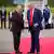 Putin and Trump shaking hands on the red carpet