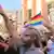Syrian Druze at protest with Druze flag visible in background