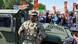 Metropolitan Police officers and military police soldiers with the District of Columbia National Guard watch as activists protest President Donald Trump's federal takeover of policing of the District of Columbia on August 16, 2025 Metropolitan Police officers and military police soldiers with the District of Columbia National Guard watch as activists protest President Donald Trump's federal takeover of policing of the District of Columbia on August 16, 2025