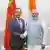 India's Prime Minister Narendra Modi shakes hand with Chinese Foreign Minister Wang Yi during their meeting in New Delhi, India August 19, 2025