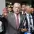 Former President Alvaro Uribe leaves court after a hearing in his trial over witness tampering and bribery charges in Bogota, Colombia, Feb. 10, 2025.