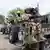 A Nigerian soldier from the Multinational Joint Task Force (MNJTF) loads his machine gun during training at the MNJTF military base