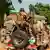 Nigerian Army soldiers are seen driving on a military vehicle in Ngamdu, Nigeria, on November 3, 2020