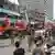 A crowd gathers at the scene of a fireworks explosion in Karachi