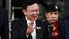 Former Thai Prime Minister Thaksin Shinawatra gestures as he leaves after a Thai criminal court Former Thai Prime Minister Thaksin Shinawatra gestures as he leaves after a Thai criminal court