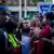 Kilmar Abrego Garcia walks through a crowd of supporters