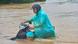 A man pushes a motorbike through a flooded street following the passage of Typhoon Kajiki in Hanoi A man pushes a motorbike through a flooded street following the passage of Typhoon Kajiki in Hanoi