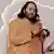 Anant Ambani speaks while wearing traditional Indian dress