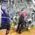 An employee working on a car production line in Germany. Archive image from November 2024.