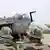 Indian soldiers standing before HAL Tejas fighter jet