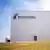 A large buidling with no windows, only one visible door, and the Rheinmetall logo in large typeset in the top left corner. Unterlüss, Lower Saxony, August 27, 2025.