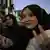 women celebrate the fall of Bashar Assad