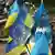 A Ukrainian flag mixed with the flag of the European Union stands among flags for sale.