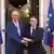 French President Emmanuel Macron shakes hands with German Chancellor Friedrich Merz