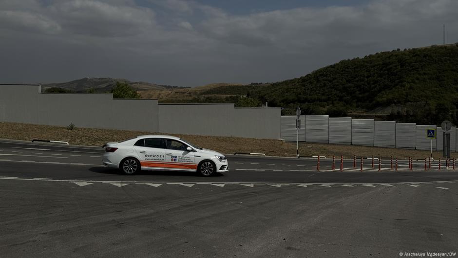 Border wall between Azerbaijan and Armenia divides village  DW  09/13/2025