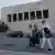 Friends and supporters of 50-year-old clinical psychologist and activist Ibtissame Lachgar, who faces trial over 'offending Islam,' walk outside the court in Rabat on September 3, 2025, ahead of a bail appeal hearing