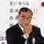 Japanese Prime Minister Shigeru Ishiba scratces his face while at a press conference