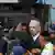 Israeli Prime Minister Benjamin Netanyahu looks on at the scene where a suspected shooting attack took place at the outskirts of Jerusalem